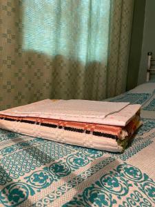 a mattress sitting on top of a bed at Sakhli Rachashi სახლი რაჭაში in Ambrolauri