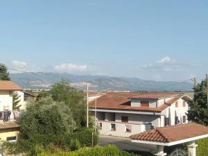 a view of a town with buildings and mountains at Villino Ulivo in Le Casette