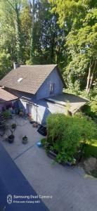 a blue house with a shingled roof at LA P'TITE MAISON in Charleroi