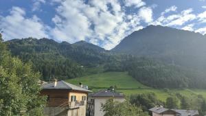 a view of a mountain with houses and trees at Casa Ettore in Lizzola Alta