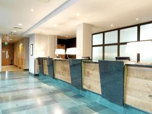 a lobby of a hotel with a reception desk at Hilton Garden Inn Birmingham Brindley Place in Birmingham