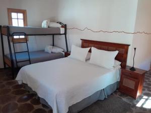 Ein Bett oder Betten in einem Zimmer der Unterkunft Hotel-Camping Takha Takha
