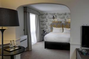 a hotel room with a bed and a television at DoubleTree by Hilton York in York