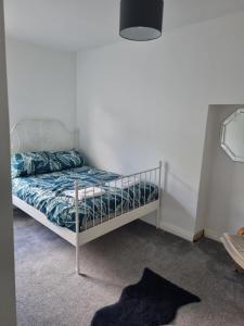 a bedroom with a bunk bed in a room at Bob's Bunkhouse in Troed-y-rhiw