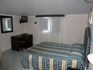 Postel nebo postele na pokoji v ubytování Hotel Borgo Antico