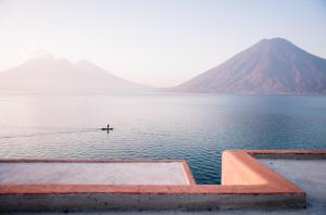 a person in the middle of a body of water at Anzan Atitlan in San Marcos La Laguna