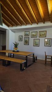 a large room with a table and two benches at CRISTOL 12 in Gargnano