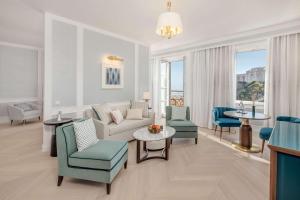 a living room with a couch and chairs at Hilton Imperial Dubrovnik in Dubrovnik