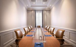 a long conference room with a long table and chairs at Hilton Imperial Dubrovnik in Dubrovnik