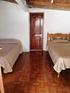 Voodi või voodid majutusasutuse Estancia, CABAÑAS INTAG toas
