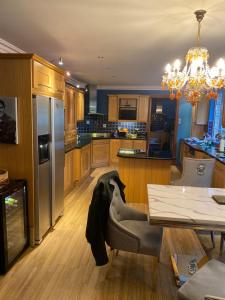 a kitchen with a table and a dining room at Winterwood in Listowel