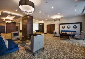 a lobby of a hotel with chairs and a waiting room at Hilton Garden Inn Isparta in Isparta