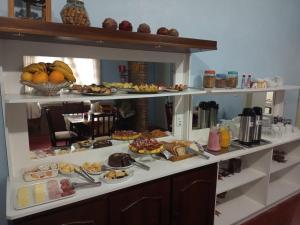 a breakfast buffet with many different types of food at Pousada O Canto do Sabia in Canela