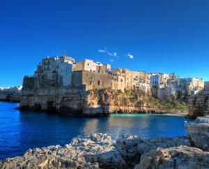 a city on top of a rocky island in the water at B&B Casa Ferrara in Monopoli