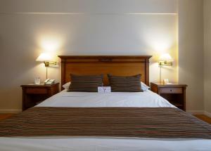 Postel nebo postele na pokoji v ubytování Scala Hotel Buenos Aires