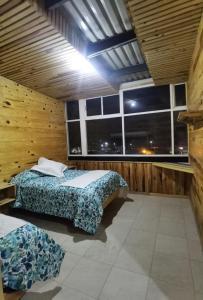 Postel nebo postele na pokoji v ubytování Rimusa Inn