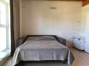 Postel nebo postele na pokoji v ubytování Palazzo Maggiore Suite B