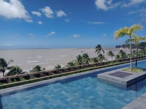 Πισίνα στο ή κοντά στο Aconchegante Flat na Beira Mar do Cabo Branco