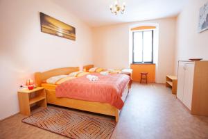 a bedroom with a bed in a room at Apartma na Starem Placu in Idrija