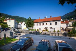 a group of cars parked in a parking lot at Apartma na Starem Placu in Idrija