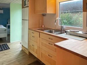 A kitchen or kitchenette at 4 person holiday home in SÖLVESBORG-By Traum