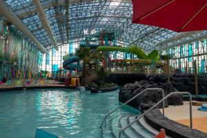 a water park with a water slide in a building at Coastal Harmony in Foley