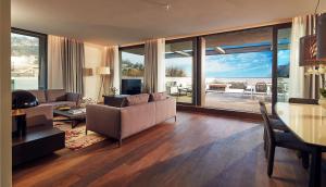 a living room with a couch and a table at Hilton Lake Como in Como