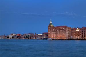a view of a city from the water at Hilton Molino Stucky Venice in Venice
