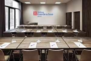 a large conference room with tables and chairs at Hilton Garden Inn Davos in Davos