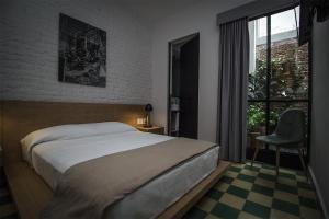 Ένα ή περισσότερα κρεβάτια σε δωμάτιο στο Casa Alfredo