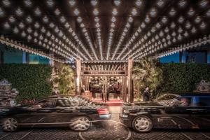 two cars parked in front of a building at Rome Cavalieri, A Waldorf Astoria Hotel in Rome