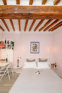 a bedroom with a large bed and a table at La Casa del Vino in Parma