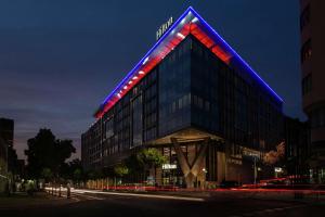 a building with a blue and red sign on it at Hilton Belgrade in Belgrade