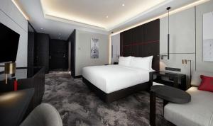 Postel nebo postele na pokoji v ubytování Hilton Belgrade