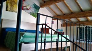 a bedroom with a bunk bed in a loft at Opera d'Oro in Piegaro