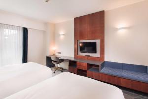 Postel nebo postele na pokoji v ubytování DoubleTree by Hilton Hotel Cluj - City Plaza