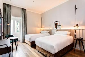 Posteľ alebo postele v izbe v ubytovaní DoubleTree By Hilton Rome Monti
