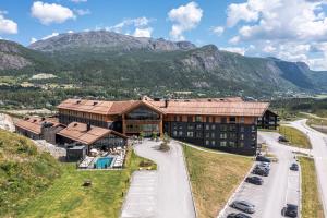 an aerial view of a hotel with mountains in the background at Hemsedal - Fyri Resort - Leiligheter in Hemsedal