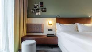 Hilton Garden Inn Mannheim客房内的一张或多张床位