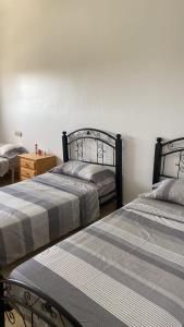 Voodi või voodid majutusasutuse Appartements Armonía Sea View toas
