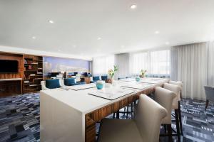 a large conference room with a long table and chairs at DoubleTree by Hilton Krakow Hotel & Convention Center in Krakow