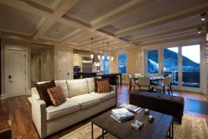 a living room with a couch and a table at The Auberge Residences at Element 52 in Telluride