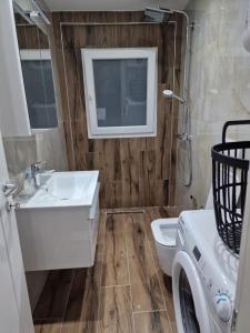 a bathroom with a sink and a toilet at Villa Pearl Adriatic Coast 4 in Golem