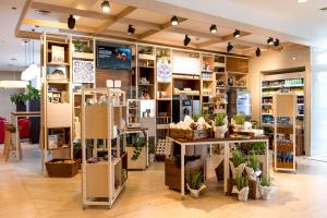 a store with a lot of plants on display at Hilton Garden Inn Krakow in Kraków