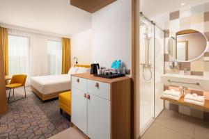 Hampton by Hilton Łódź City Center客房内的一张或多张床位