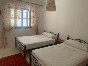 Una cama o camas en una habitación de Casa gharbi