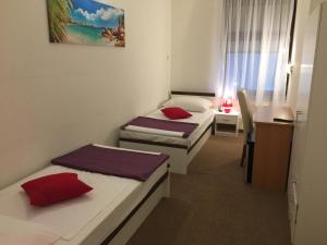 Postel nebo postele na pokoji v ubytování Pansion Ruža