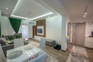 a living room with a couch and a table at Apartment Lara in Ulcinj