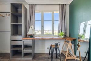 a home office with a desk and a window at Beautiful 2-room apartment with a view in Lyon - Welkeys in Lyon