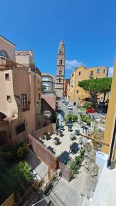 a view of a city street with a clock tower at CAIETA Housing in Gaeta